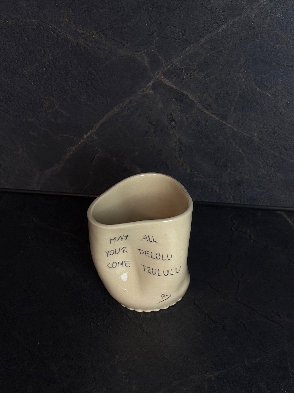 “May all your delulu come trululu “ šalica